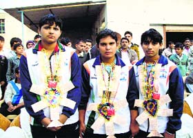 Ram Bateri, Suman and Reena, members of the Indian womens team that won the World Kabaddi Cup, during their reception at Tohana in Fatehabad on Sunday