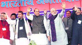 BJP prime ministerial candidate Narendra Modi, party president Rajnath Singh with leaders of the Uttarakhand unit in Dehradun on Sunday.