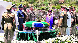 A grab taken from the South African Broadcasting Corporation live feed shows armymen standing around the coffin of Mandela before it is lowered into the grave