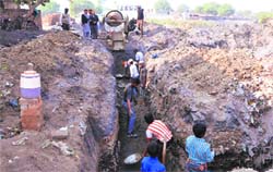 Work under way at the site of a school building at Dhobiana Basti in Bathinda on Monday. Tribunephoto