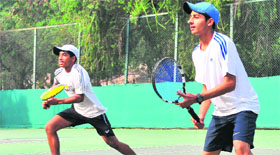Players in action during a match of the CLTA-AITA Championship Series Tennis Tournament in Chandigarh on Monday.