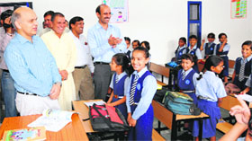 KK Sharma, Adviser to the UT Administrator, interacts with students after inaugurating Government Middle School at Sector 18 in Chandigarh.