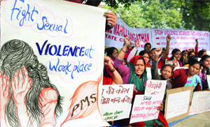 Activists hold placards as they gathered to pay homage to Nirbhaya at Jantar Mantar in New Delhi on Monday.