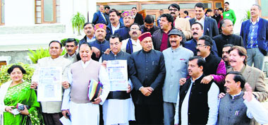 BJP leaders protest in front of the Vidhan Sabha complex at Tapovan near Dharamsala on Monday.
