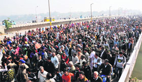 West Pakistan Refugees block the Tawi bridge during a protest in Jammu on Monday.
