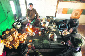A cook prepares harissa in Srinagar on Monday.