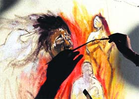 Remembering nirbhaya: An artist paints during a demonstration in Kolkata on Monday on the 1st anniversary of the gang rape and murder of a 23-year-old student at Delhi