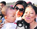 Actress Sushmita Sen (centre), Mary Kom and her son Prince at the book release. PTI