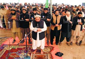 Hafiz Mohammad Saeed (C) leads funeral prayers for Islamist leader Abdul Quader Molla, in Multan on Monday
