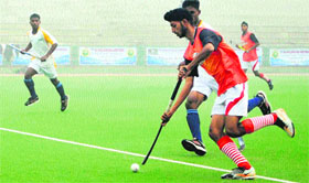 Players in action during a match in the 11th All India Maharaja Ranjit Singh Junior Gold Cup Hockey Tournament at GNDU in Amritsar on Tuesday.
