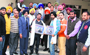 Members of Baba Makhan Shah Lobana Foundation honour Lobana players, who took part in the World Cup Kabaddi, in Chandigarh on Tuesday.