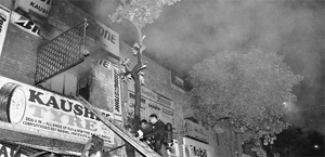Firefighters battle flames on the first floor of a shop at the Motor Market in Sector 48, Chandigarh, on Tuesday. 