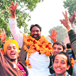 Lachhman Singh Chhota, who has been elected sarpanch of Raipur Khurd, celebrates his victory with his supporters in Chandigarh on Tuesday. 