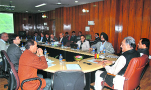 Chief Minister Vijay Bahuguna chairs a meeting of senior state government officials at the Secretariat in Dehradun on Tuesday to review road repair works. 