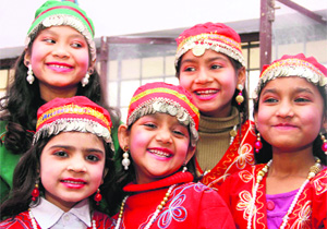 Students of St Johns School wait for their performance during their annual function in Dehradun on Tuesday. 