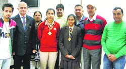Deputy Commissioner NK Solanki honours gold medallists in Kaithal on Tuesday. Photo: Satish Seth