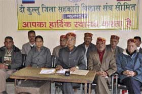 Satya Prakash Thakur, president, Kullu Jila Sahkari Vikas Sangh Samiti, addresses mediapersons at the Sahkar Bhawan in Sarwari in Kullu on Monday