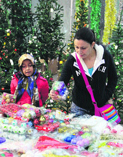 A woman busy in Christmas shopping in Jalandhar on Tuesday.