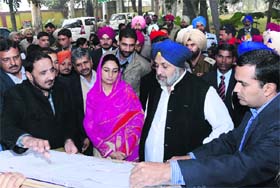 Deputy CM Sukhbir Badal along with MP from Bathinda Harsimrat Kaur Badal takes a look at the map of the mini zoo-cum-deer safari in Bathinda on Wednesday