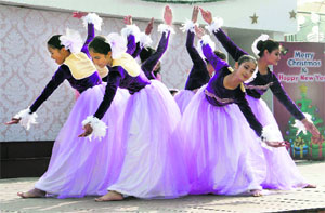 Students of Aryan School perform to celebrate Grandparents Day and Christmas in Dehradun on Wednesday. 