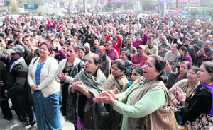 Employees of nationalised banks stage a demonstration in Dehradun on Wednesday