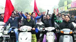 Bank employees take out a scooter rally during their nationwide strike, in Jalandhar on Wednesday. Photo: Sarabjit Singh