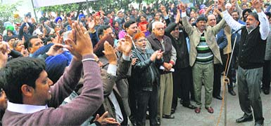 Naresh Gaur, convener of the United Forum of Bank Union, addresses bank employees during the all-India banks strike