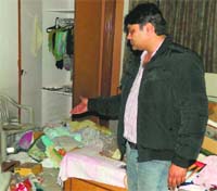 Industrialist Minku shows the ransacked room in Ludhiana on Wednesday. A Tribune Photograph