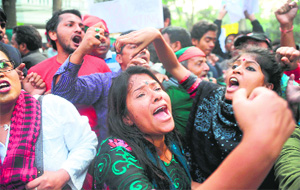 Social activists raise slogans against Pakistan as they march towards the Pakistan High Commission in Dhaka on Wednesday. 