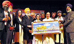 Davinder Mohan Singh Chinna, president, Punjab Culture Promotion Council, with artists from Italina dance group, Nomadi, on Thursday
