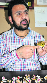 Jagtej Singh shows hallmarked jewellery at the HG Testing and Hallmarking Centre in Bathinda on Thursday.
