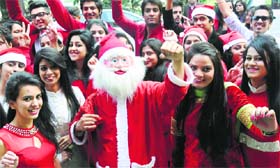 FESTIVITIES IN THE AIR: INIFD students celebrate Christmas with Santa Claus at the Community Centre in Sector 27, Chandigarh, on Thursday