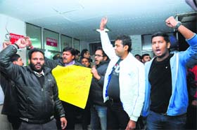 People hold a protest against the rape accused at the GMSH-16 on Thursday night