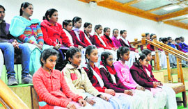 Schoolchildren watch the proceedings of the Vidhan Sabha at Tapovan near Dharamsala on Thursday.