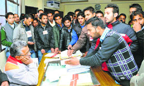 Activists of the Students Federation of India gherao the Controller of Examinations at Himachal Pradesh University in Shimla on Thursday.