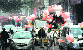 A Christmas procession passes through a city market on Thursday.