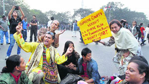 LGBT people and supporters protest against the Supreme Court's recent verdict on Section 377 of the Indian Penal Code, in Kolkata on Thursday. 