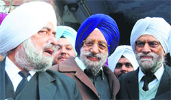 Nirmal Singh Kahlon (centre), former Speaker, outside the court complex in Mohali on Thursday.