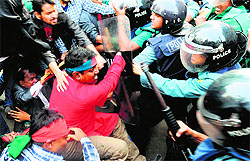 Anti-riot police clash with social activists during their procession to the Pakistan High Commission in Dhaka on Thursday