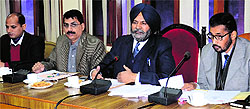 Dr Dalbir Singh Verka (second from right), Commissioner, Right to Service Commission, holds a meeting with officials of the district administration in Amritsar on Friday