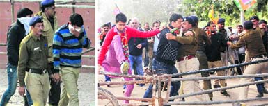 Two of the rape accused constables being taken to the District Courts in Sector 43, Chandigarh, on Friday (L) and  Protesting against the rape incident, BJP workers try to push their way through a barricade at the Police Headquarters in Sector 9, Chandigarh, on Friday. Tribune photos