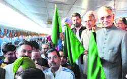 UT Administrator Shivraj V Patil and other dignitaries flag off a train from the Chandigarh railway station. A file photo