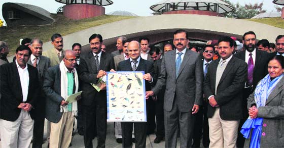 KK Sharma, Adviser to the UT Administrator, releases a calendar after inaugurating the Nature Interpretation Centre at the Regulator End of the Sukhna Lake in Chandigarh on Friday. A Tribune photograph