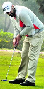 A golfer plays a shot during the Chandigarh Golf Tournament at the Golf Club on Friday. Tribune Photo: S Chandan