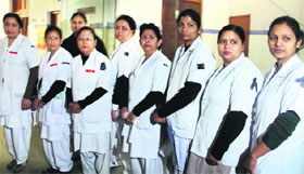 Nurses wear black badges in support of their demands at Doon Hospital on Friday.