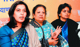 Saroj Pandey (left), national president of the BJP womens cell, addresses party workers in Karnal on Friday.