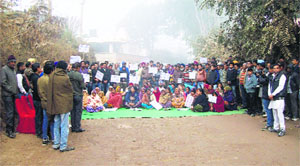 Villagers protest against the slow progress in construction of the 14-km stretch of the NH 21-A near Dattowal in Nalagarh subdivision of Solan district on Friday.