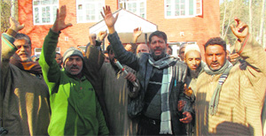 Labourers hold a protest in Kupwara. 
