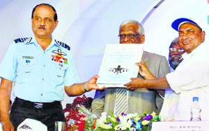 Union Defence Minister AK Antony (right) handing over the Release to Service document to Air Chief Marshal NAK Browne during initial operational clearance of Light Combat Aircraft Tejas for its induction into the IAF, in Bangalore on Friday. 