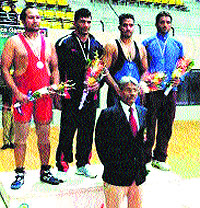 Vikram Sharma (second from right) receives bronze medal at the recently concluded police games